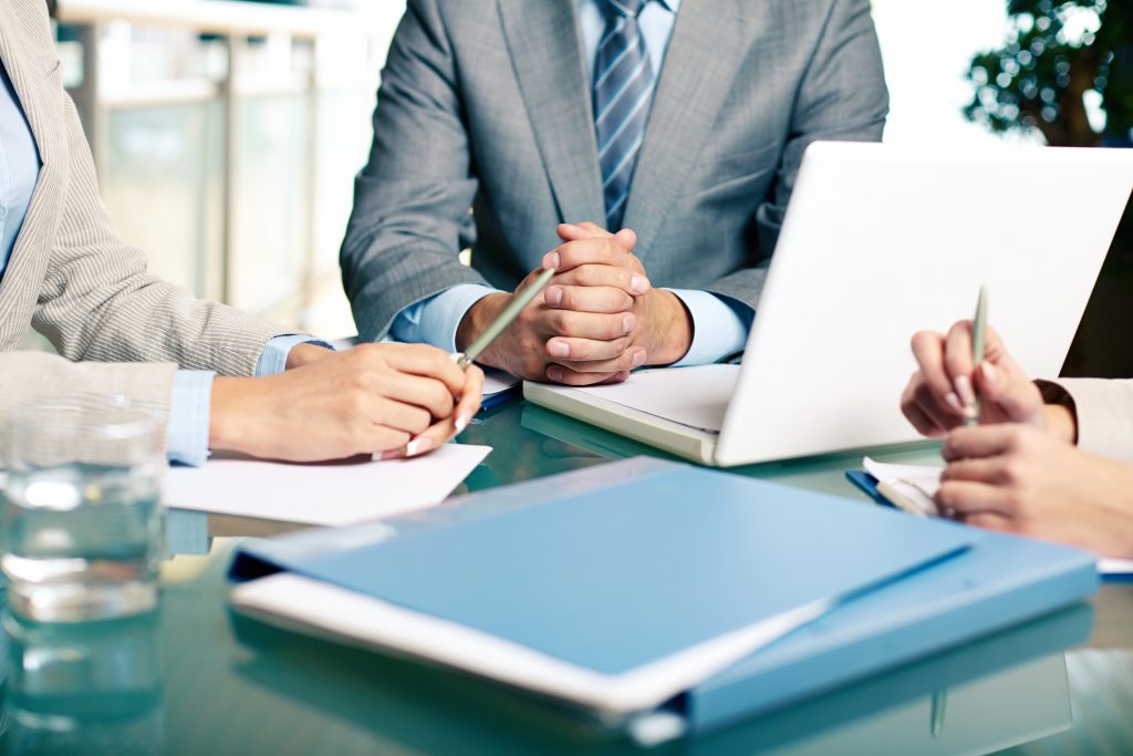 close up of executives sitting at the table 1024x683